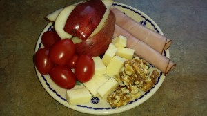 Lunch-2 slices ham, 1 pear, 3 domino sized pieces of cheddar, cherry tomatoes and about 10 walnuts left me full until dinner time.